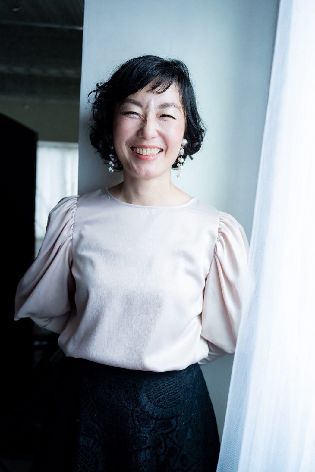 個別相談イメージ：笑顔の女性